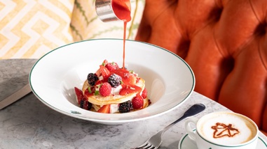 Pancakes with fresh berries and compote at The Ivy, Canary Wharf