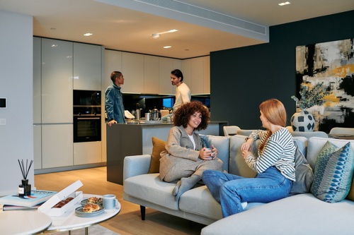 Residents enjoying modern apartment living room