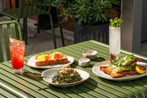 Outdoor dining brunch plates with drinks on the table